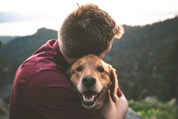 Man hugging dog